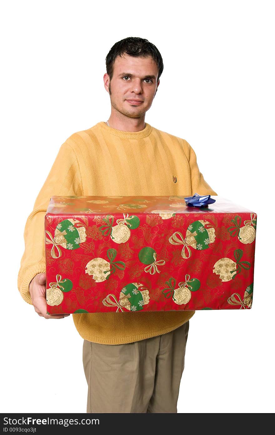 A young handsome guy carrying a huge stack of christmas presents. A young handsome guy carrying a huge stack of christmas presents