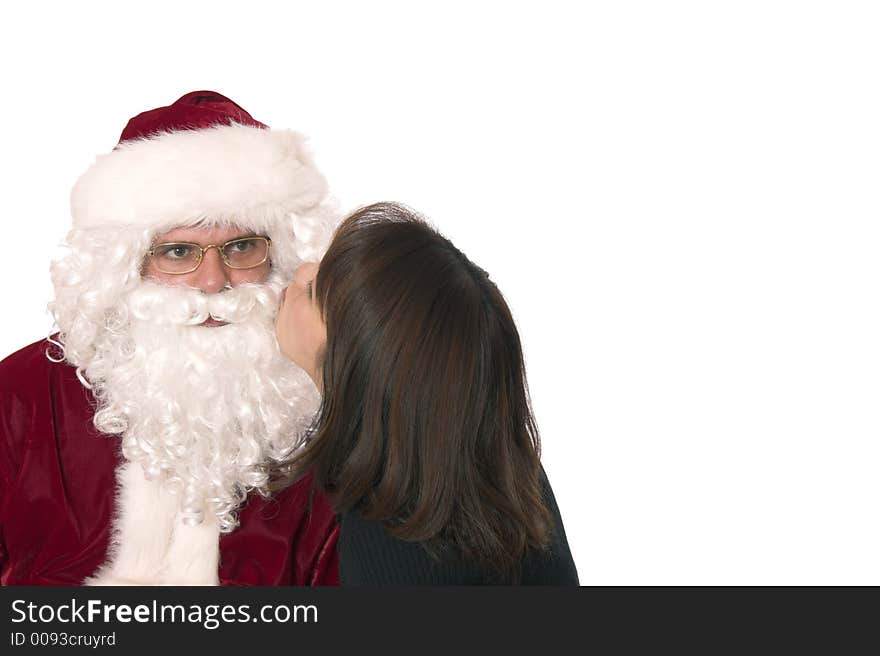 Santa getting a kiss from a cute lady. Santa getting a kiss from a cute lady