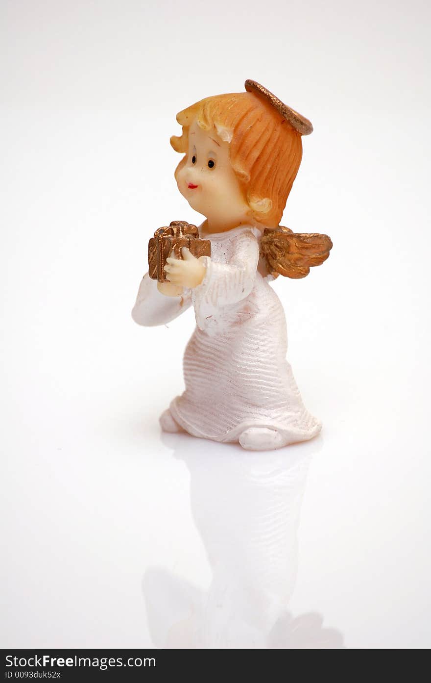 Figurine of an angel with a gift