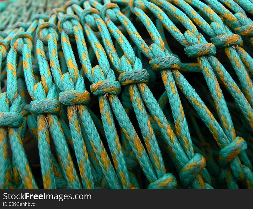 Green fishing nets in harbour