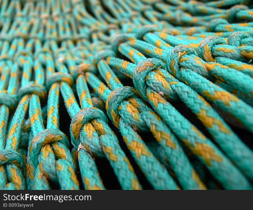 Green fishing nets in harbour