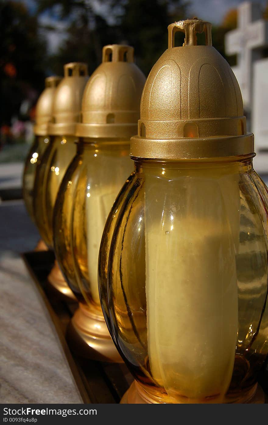 Yellow candles on a grave