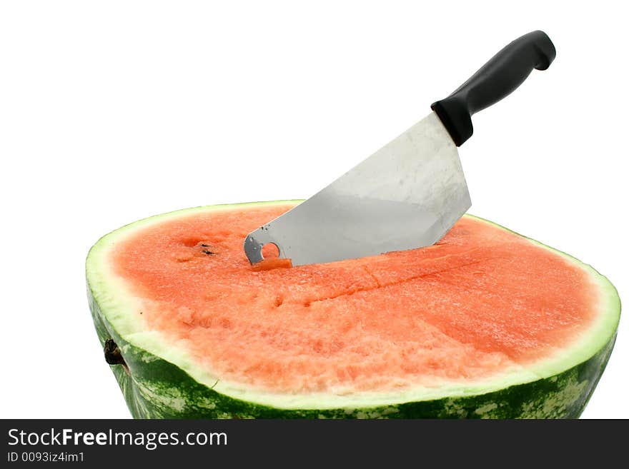 Fresh half of watermelon with cleaver