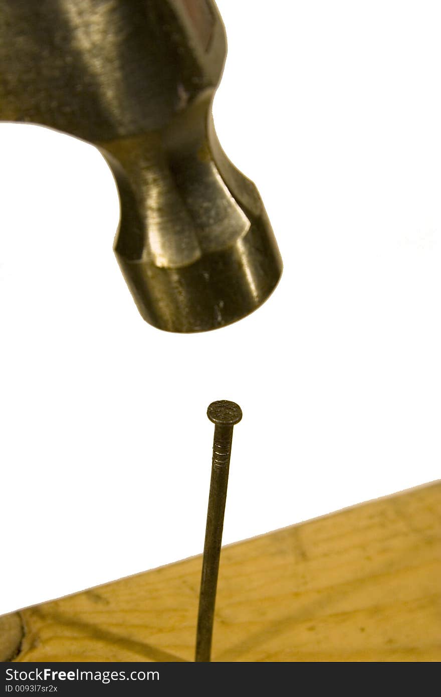 Close up of a hammer and nail isolated on white back ground. Close up of a hammer and nail isolated on white back ground