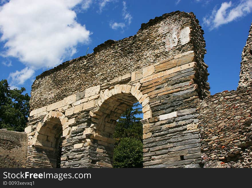 An ancient roman aqueduct that were used to transport water from one city to another. An ancient roman aqueduct that were used to transport water from one city to another.