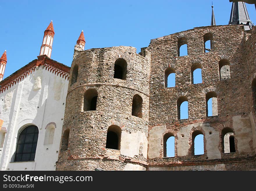 An ancient roman monument in a city in Italy. An ancient roman monument in a city in Italy.