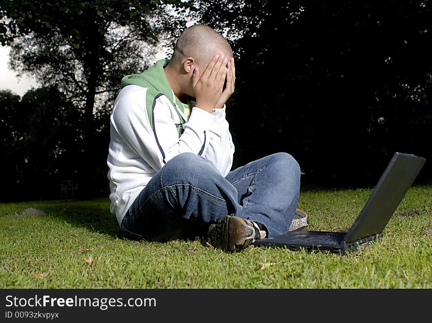 Picture of boy with notebook in park