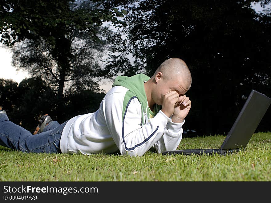 Picture of boy with notebook in park