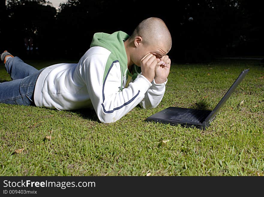 Picture of boy with notebook in park