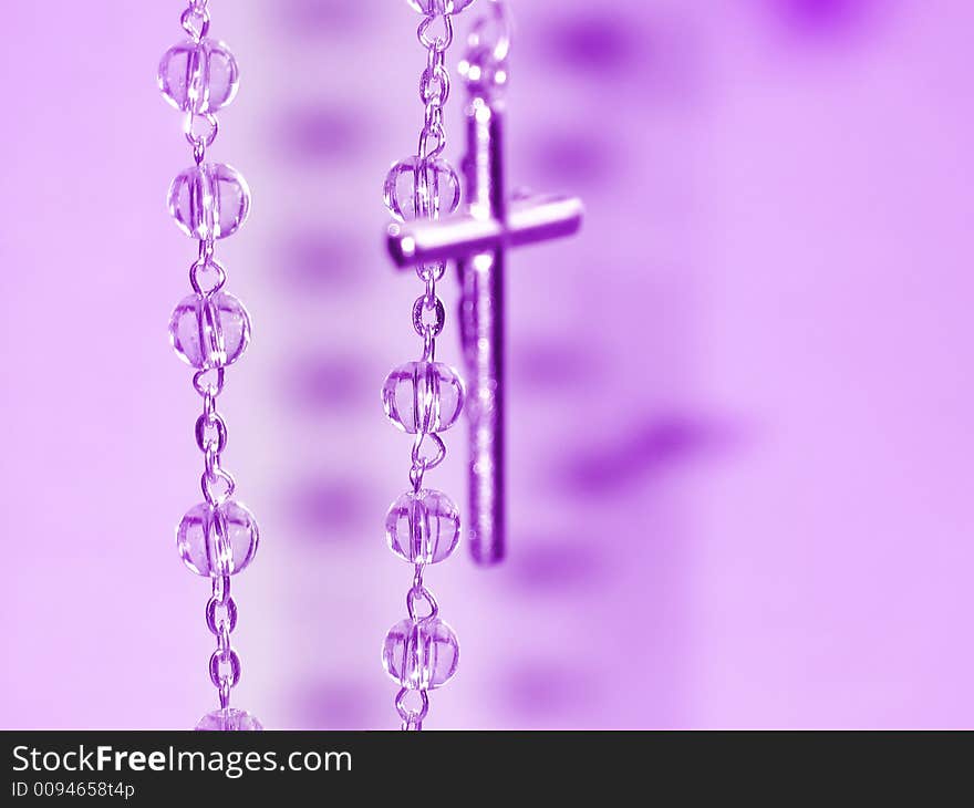 Prayer beads in a close up view and purple color shade. Prayer beads in a close up view and purple color shade.