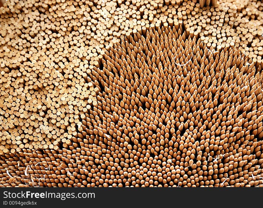 A pile of wooden bamboo sticks. A pile of wooden bamboo sticks