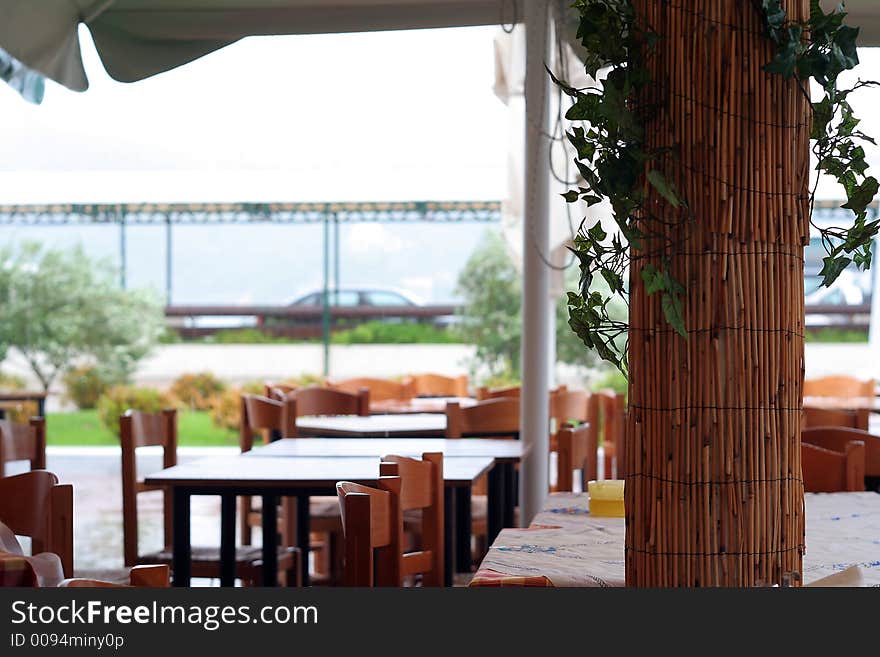 Terrace restaurant with bamboo column, tables and chairs