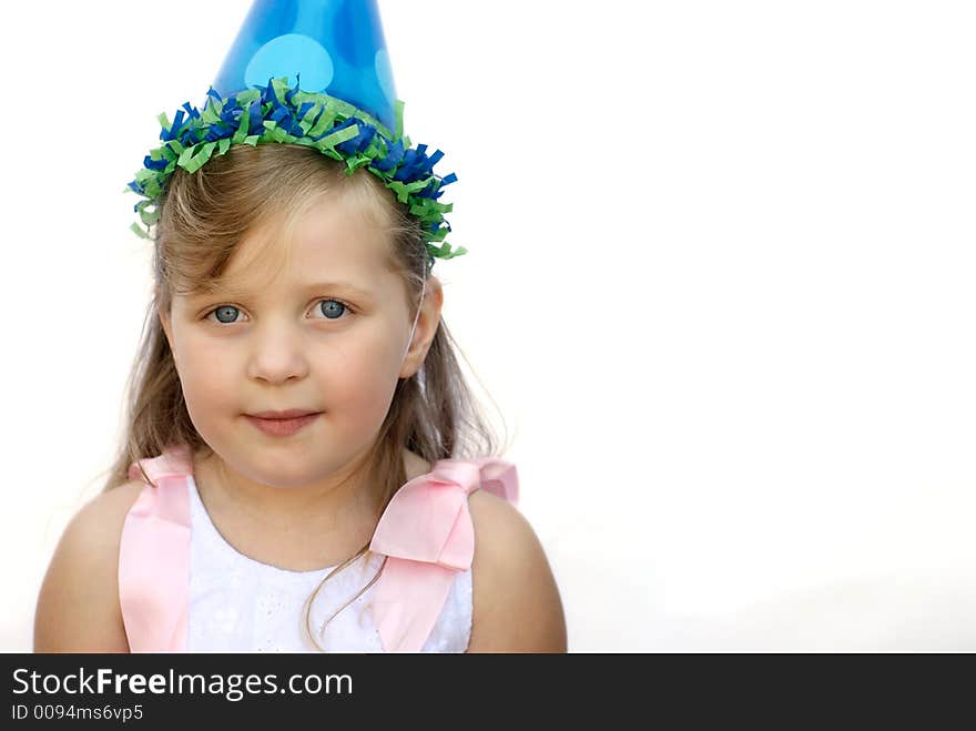 Happy young girl wearing party hat on white background