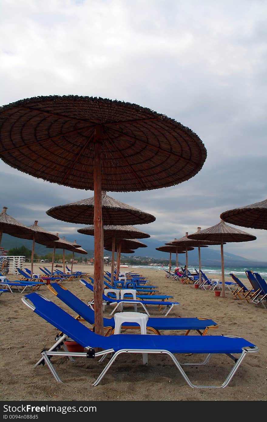 Sun loungers and beach umbrella. Sun loungers and beach umbrella