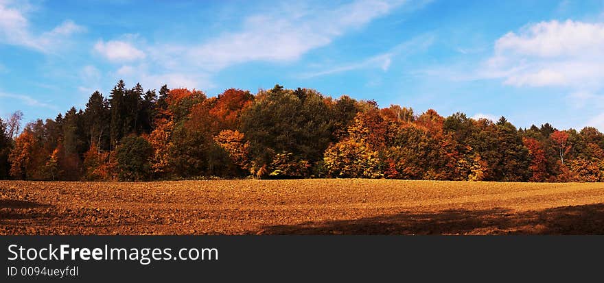 Colorful Panorama Autumn landscape with blue sky