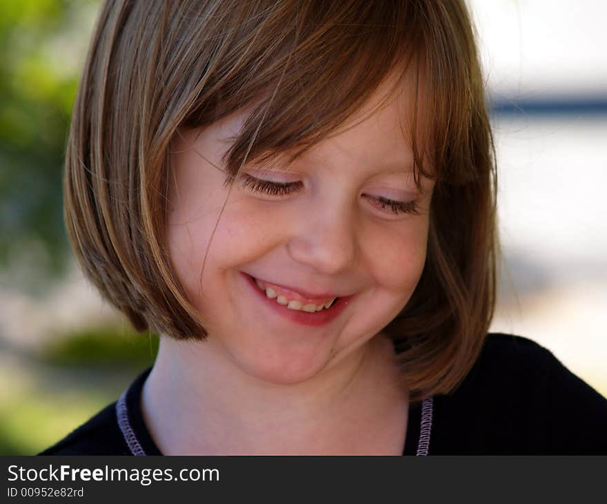 Happy Smiling Girl Looking Down