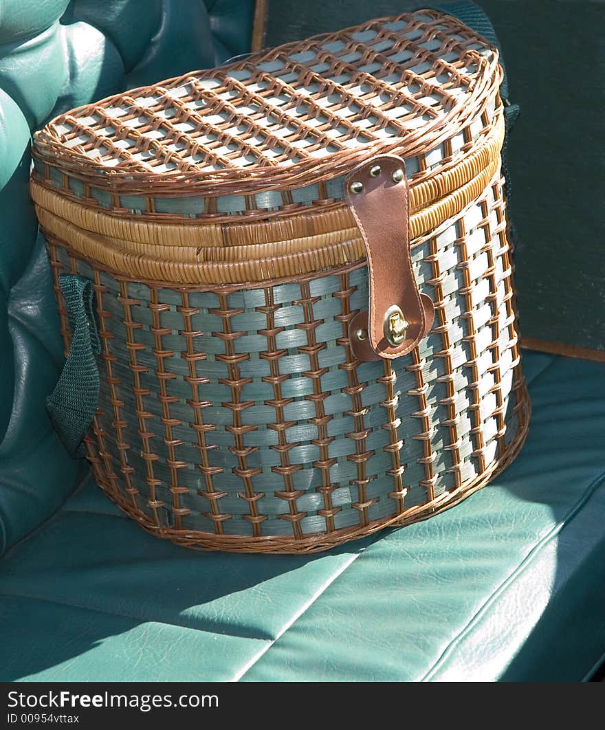 Blue wicket picnic basket on a boat