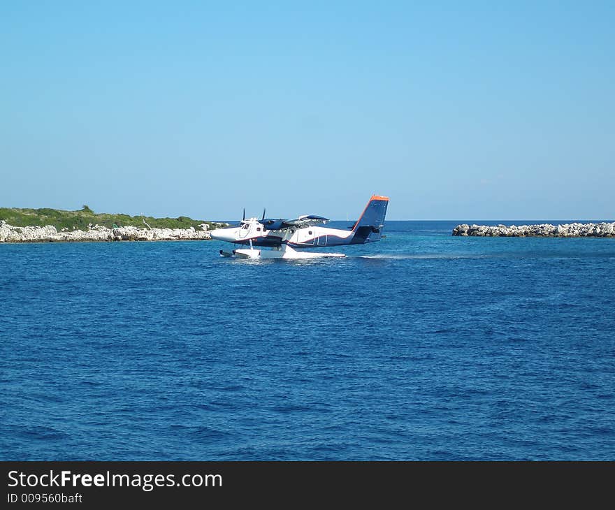 Sea plane taking off from the sea