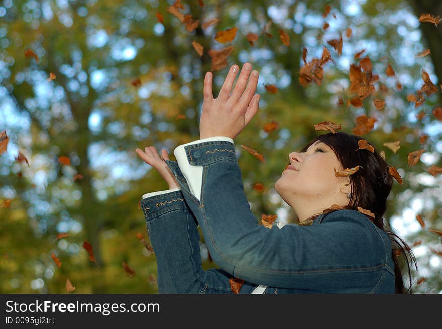 Attractive woman with colourful leaves. Attractive woman with colourful leaves