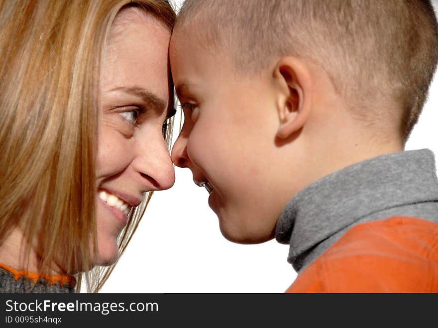 Mother and son touching heads and smiling