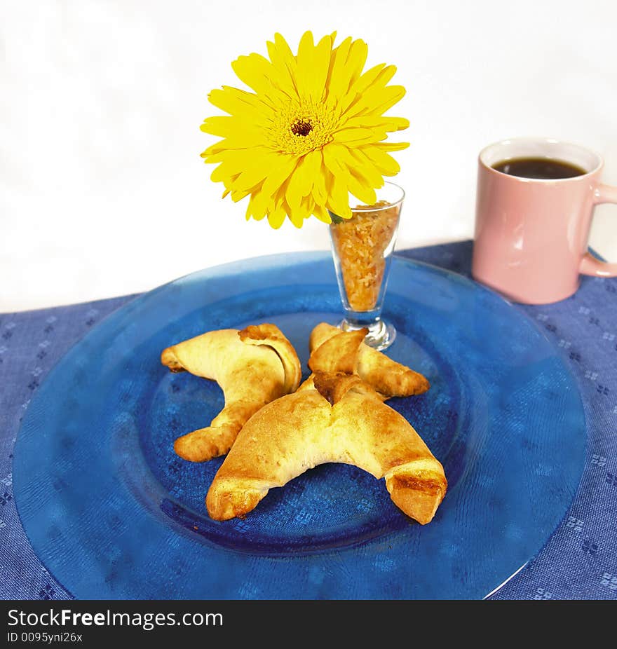 French style breakfast croissants or horns served with a black cup of coffee. French style breakfast croissants or horns served with a black cup of coffee