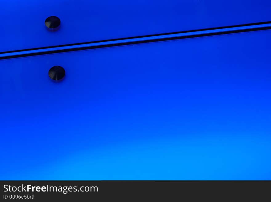 Close-up of a joint between two illuminated display panels with detail on the rivets holding them in place. Abstract graphic image suitable for background. Close-up of a joint between two illuminated display panels with detail on the rivets holding them in place. Abstract graphic image suitable for background.