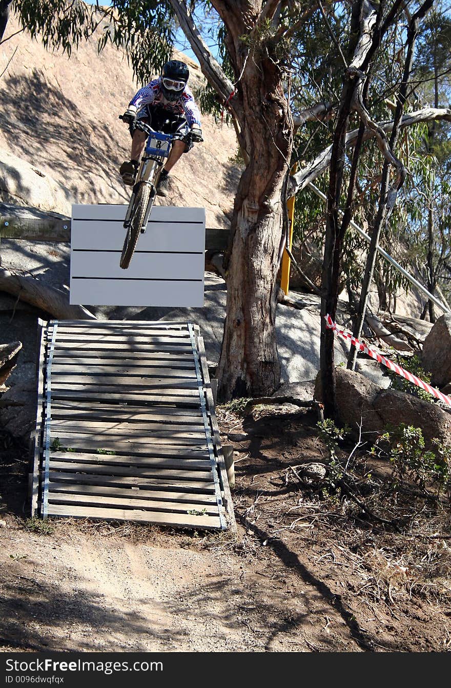 Extreme mountain biker with lots of air