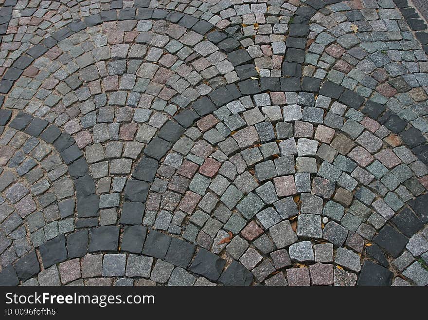 Fragment of the cobblestone road. The photo taken at the historical center of the Riga (Latvia, Europe). Fragment of the cobblestone road. The photo taken at the historical center of the Riga (Latvia, Europe)