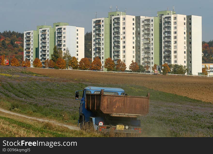 Many flats in suburb behind the city. Many flats in suburb behind the city