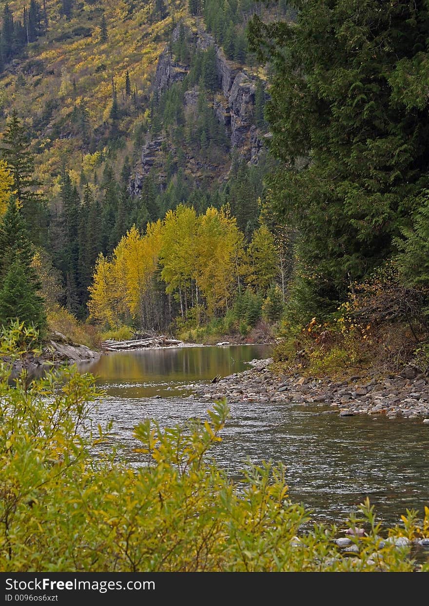 This image of the creek, mountain side and fall colors was taken in western MT. This image of the creek, mountain side and fall colors was taken in western MT.