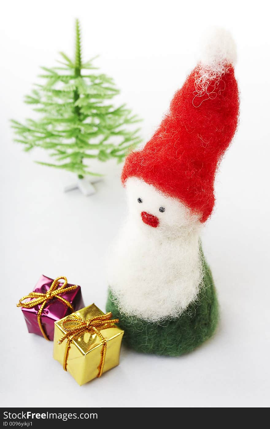 Christmas elf with gifts and tree on white background. Christmas elf with gifts and tree on white background