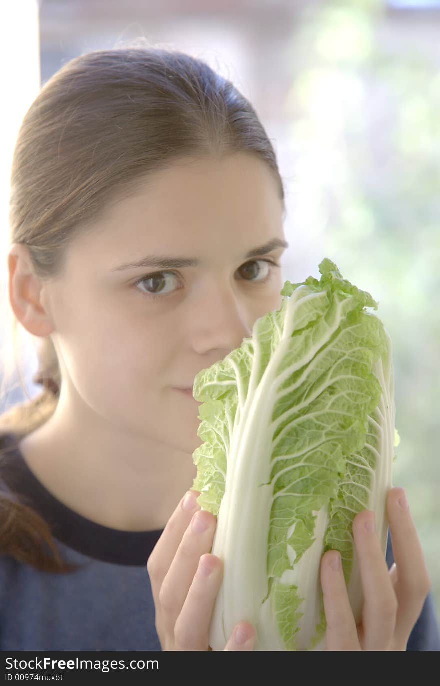 Pretty young woman with salad