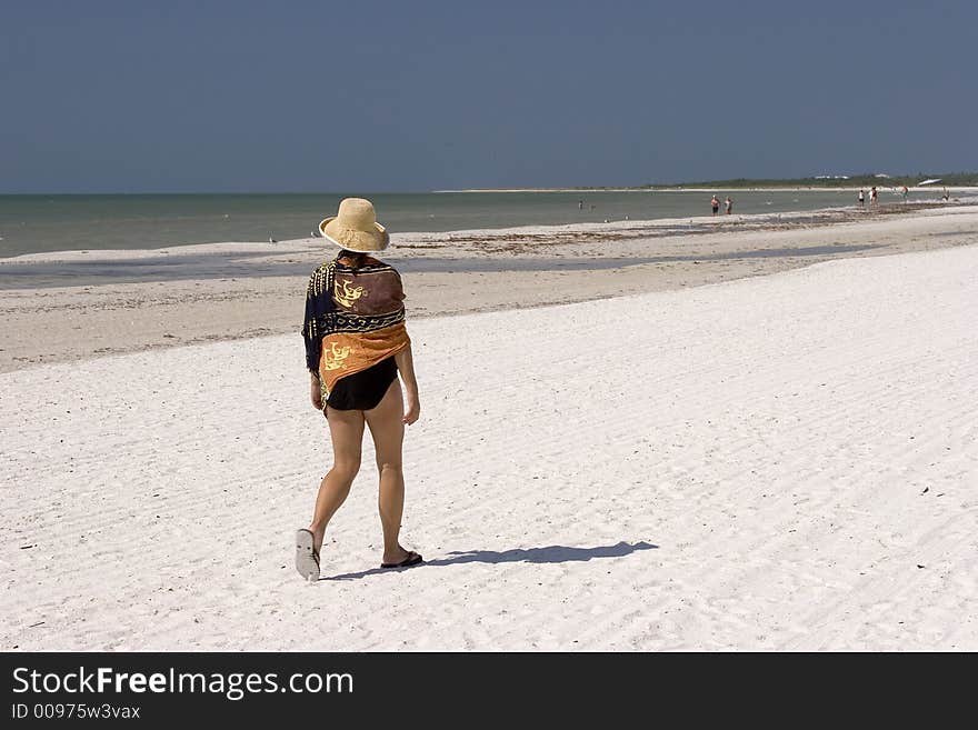 Woman Walking on the Beach