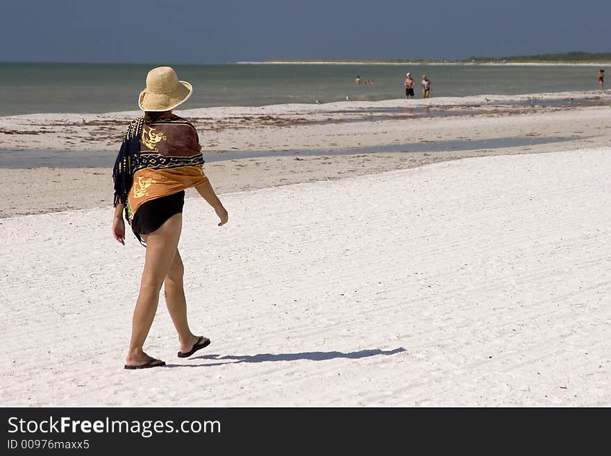 Woman Walking on the Beach