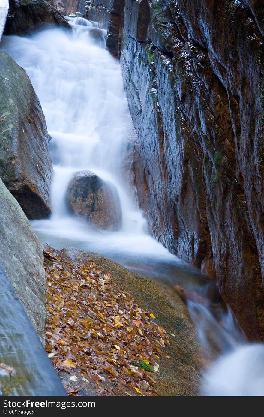 River waterfall through rock gorge. River waterfall through rock gorge.