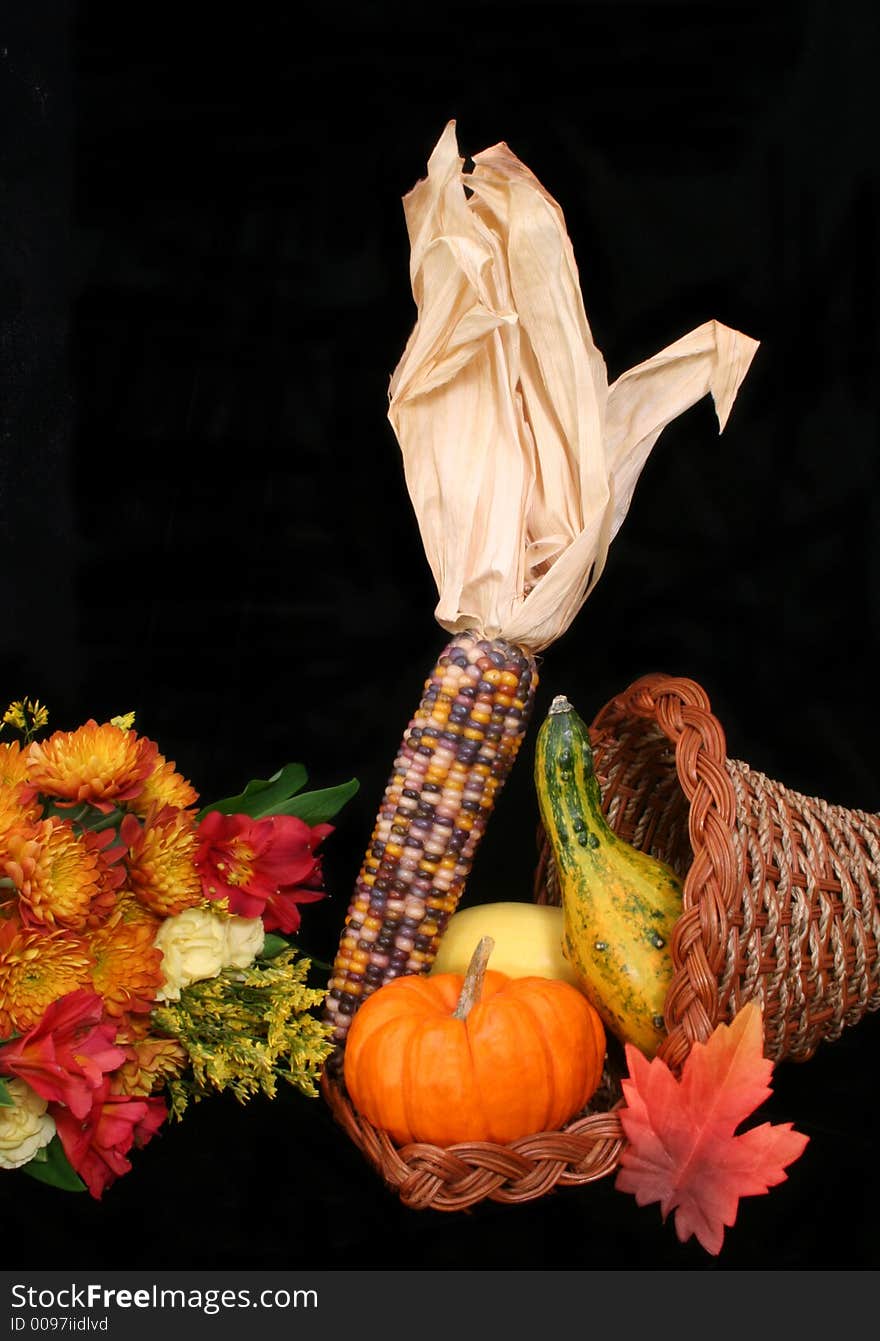 Cornucopia With Autumn Flowers and Vegetables on Black Background