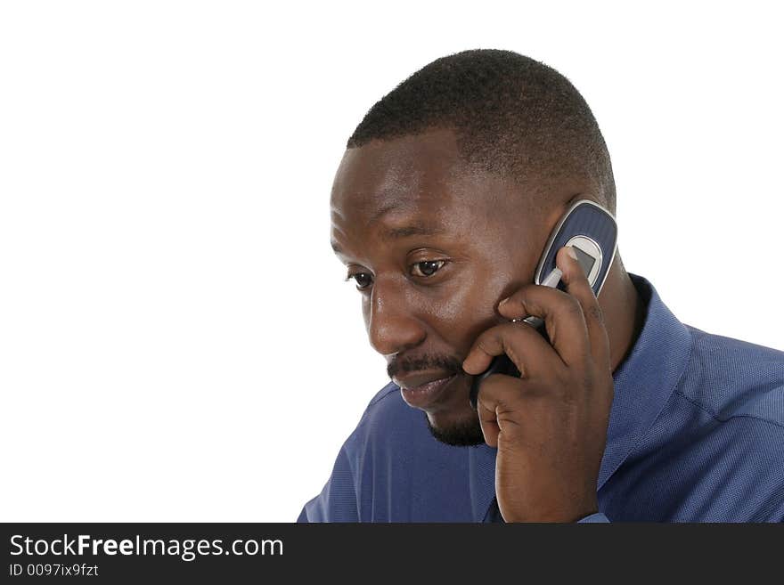 Handsome Business man taking a call on his Cellphone with which he is not pleased. Handsome Business man taking a call on his Cellphone with which he is not pleased.