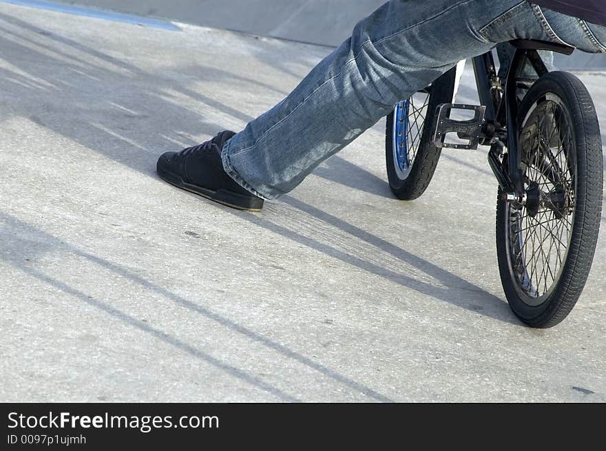 Close up of male leg on bike. Close up of male leg on bike