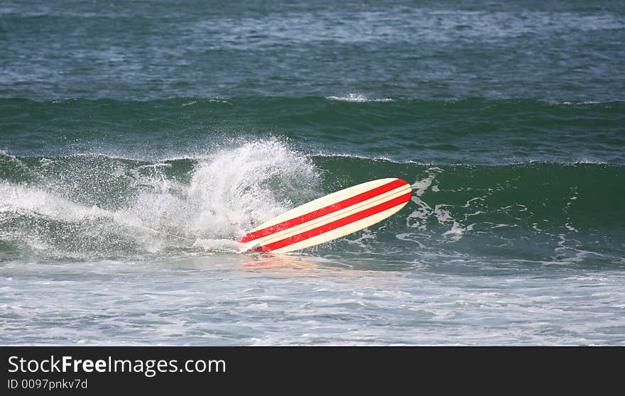 Surfer falls in the sea. Surfer falls in the sea