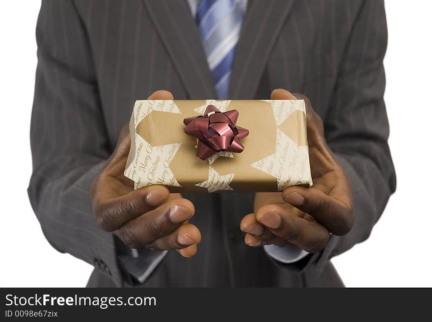 This is an image of a hand offering a christmas present. This is an image of a hand offering a christmas present.