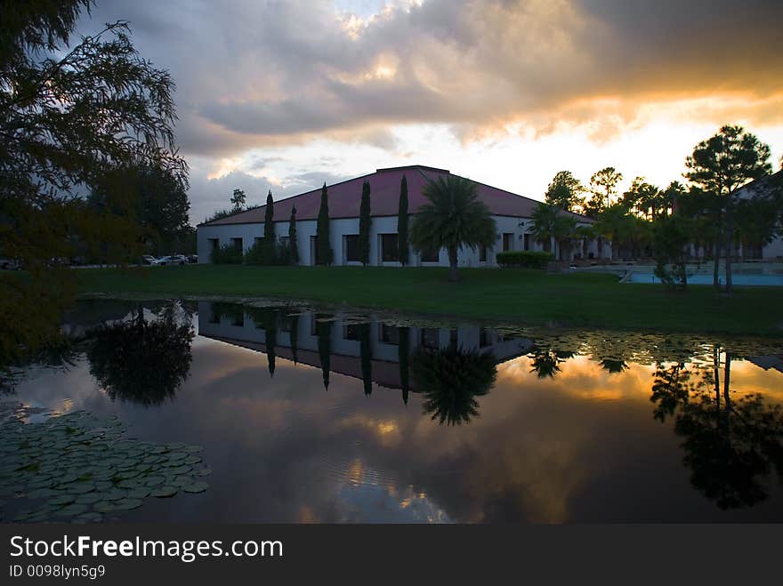 A Commercial building with a water reflection at sundown. A Commercial building with a water reflection at sundown