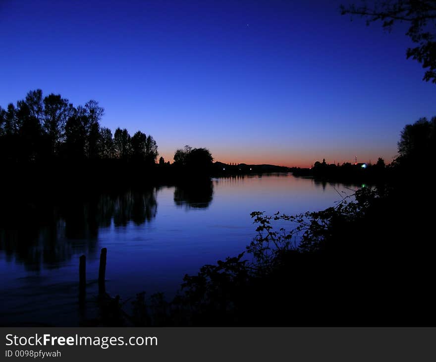 Beautiful blue sunset over the Skagit River,  Washington state, USA. Beautiful blue sunset over the Skagit River,  Washington state, USA