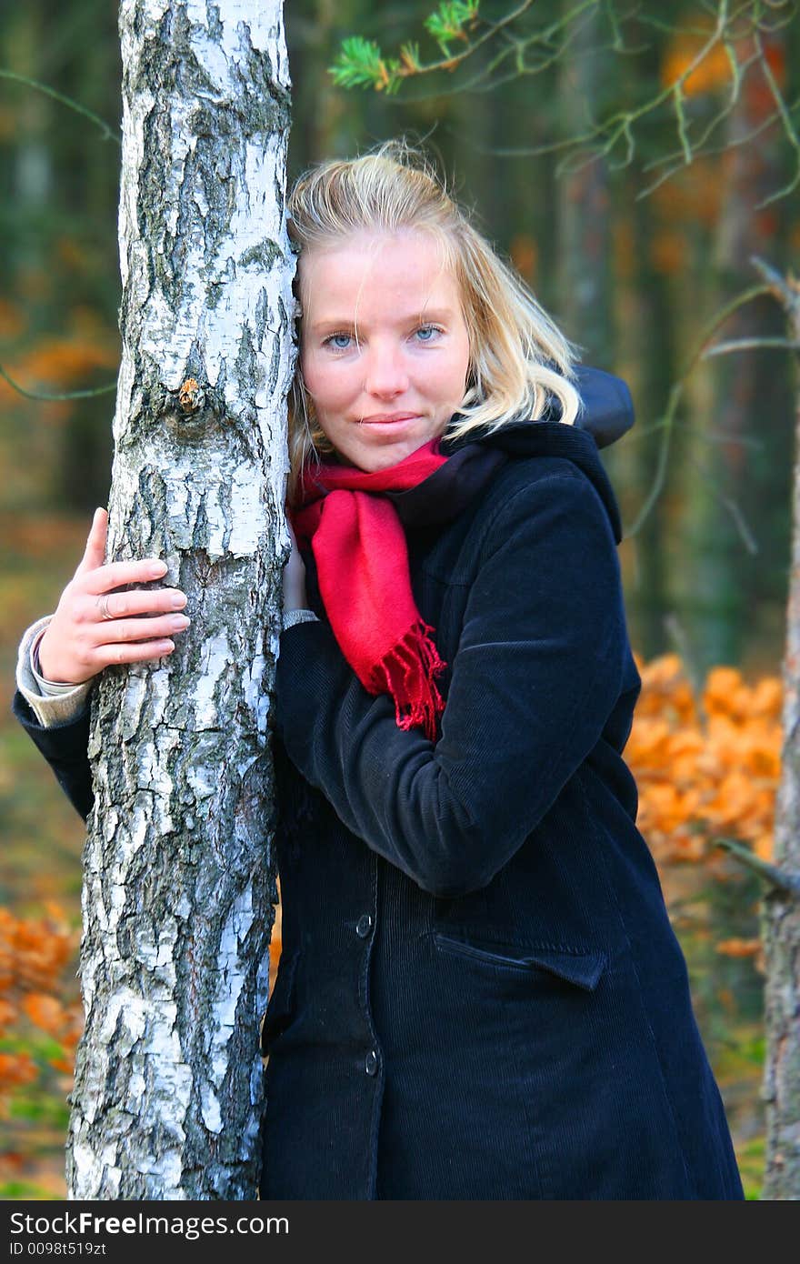 Blonde woman in an autumn wood. Blonde woman in an autumn wood