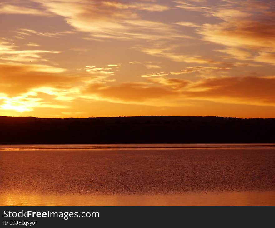 Orange Sunrise On a Lake in Colorado