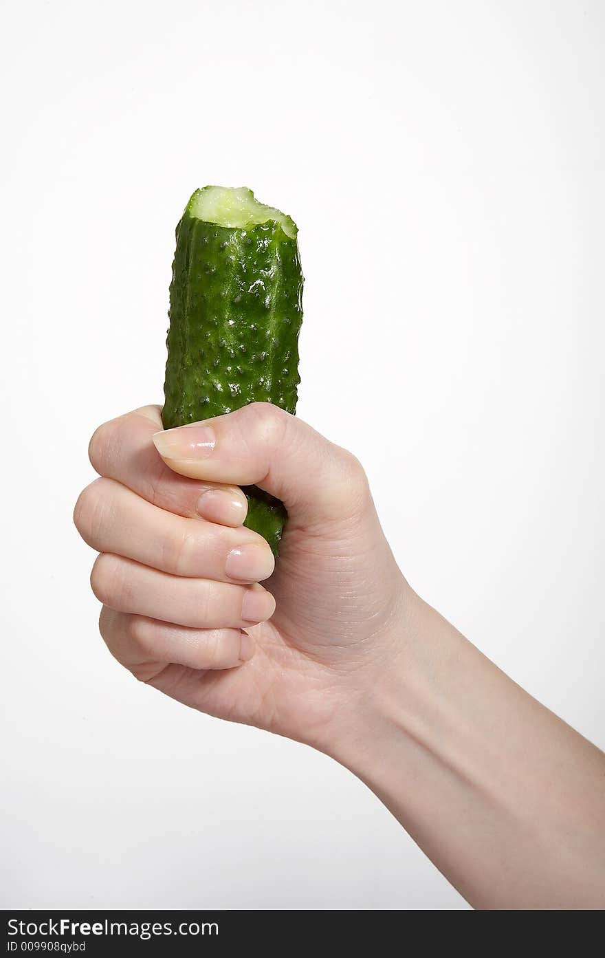 Hand with cucumber on white isolated background