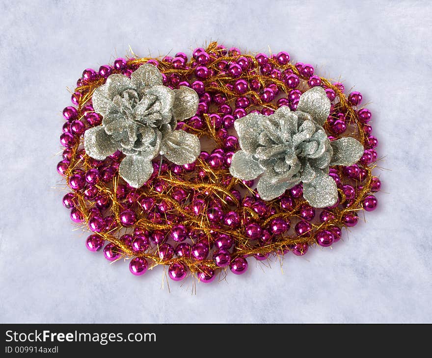 Garland And Silver Pinecones On The Snow