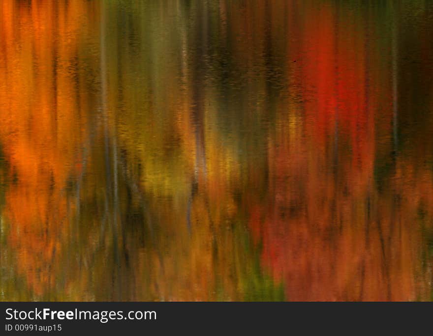 A beautiful scene of brilliant trees reflecting in water. A beautiful scene of brilliant trees reflecting in water