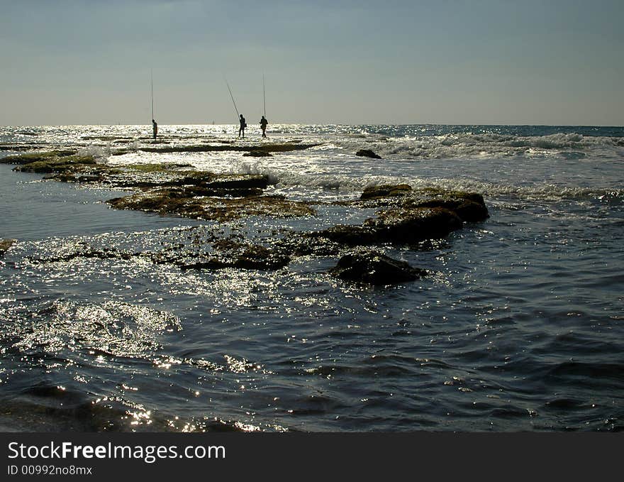 Fishermens in the mediteranian sea in Ceasarea Israel. Fishermens in the mediteranian sea in Ceasarea Israel