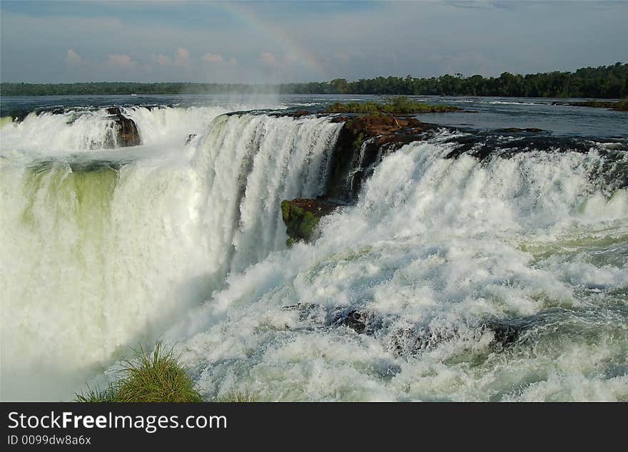 Devil´s throat at world largest Waterfalls Falls in Iguazu on a bright sunny day