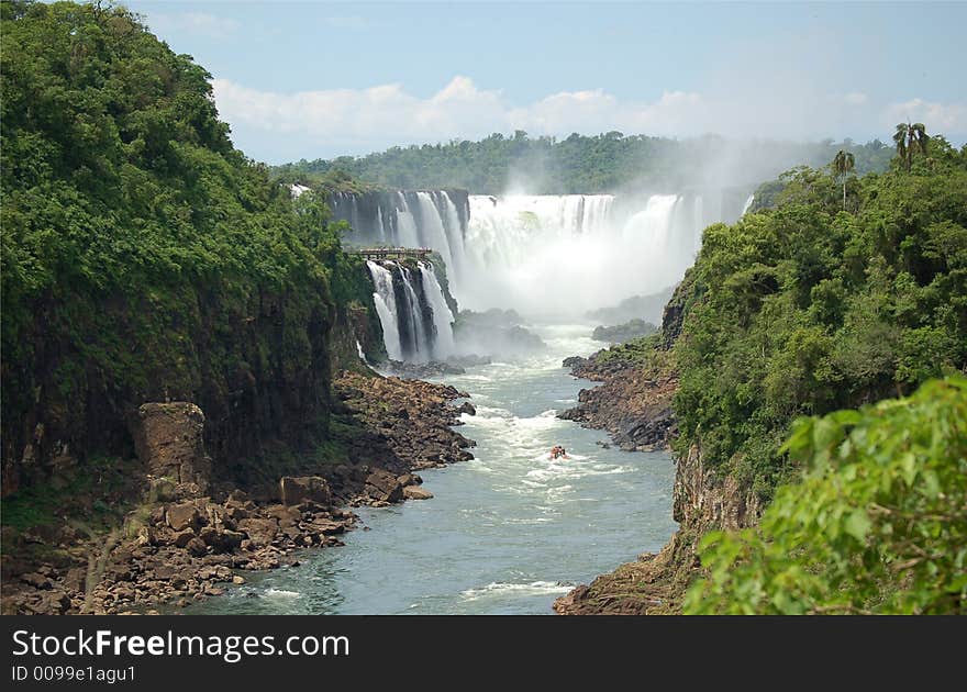 Devil´s throat at world largest Waterfalls Falls in Iguazu on a bright sunny day. Devil´s throat at world largest Waterfalls Falls in Iguazu on a bright sunny day